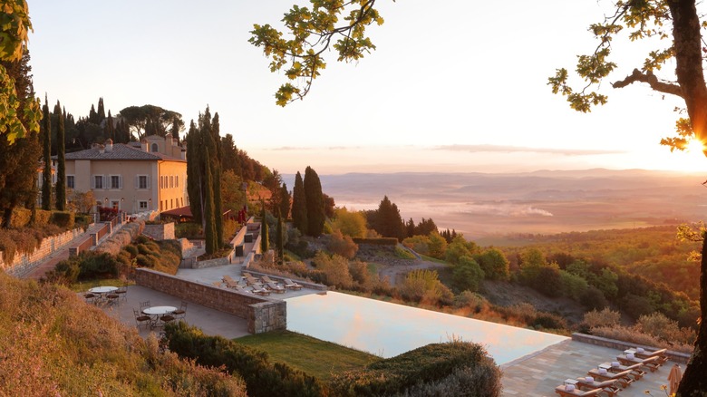 View of the swimming pool at sunrise at Castiglion del Bosco, A Rosewood Hotel
