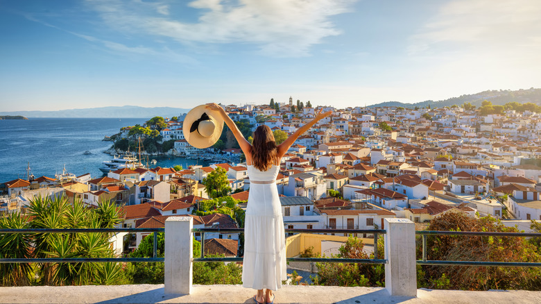 A woman overlooking the town of Skiathos in Greece