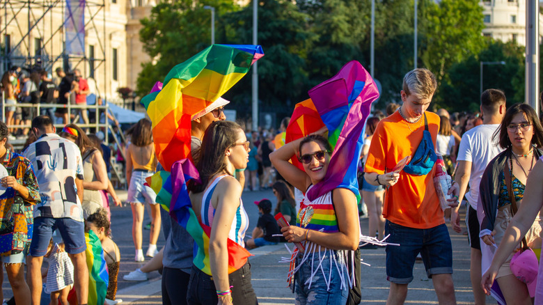Girls with rainbow flags at pride event in Madrid