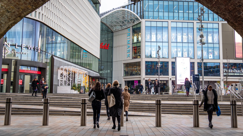 People walking around outside the Westfield mall in Shepherd's Bush, London