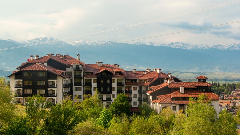 View of guesthouses nestled in a valley below the Pirin Mountains in Bansko, Southwestern Bulgaria