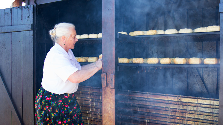 A woman making oscypek cheese in Poland's Tatra Mountains
