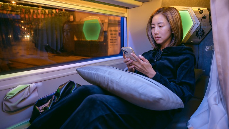 Woman on a night bus