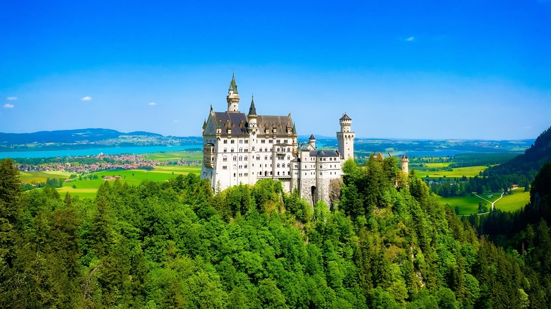 close up detail of pointed towers and windows of neuschwanstein castle