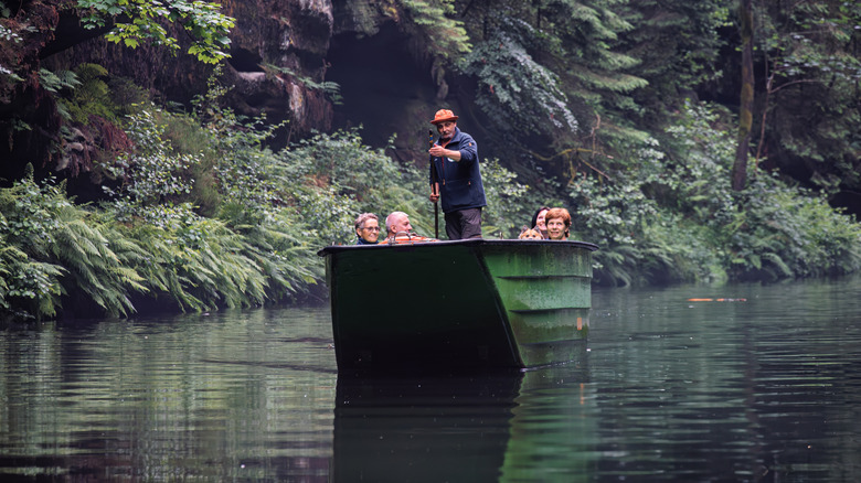 Tourists in the boat at (Edmund's Gorge) near Hrensko in Bohemian Switzerland, Czechia