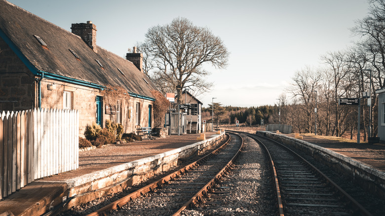 Railway station platform and train tracks