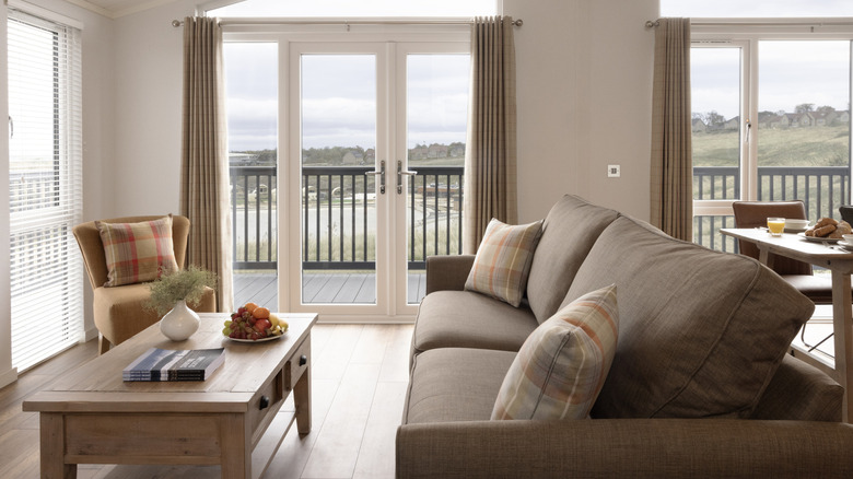 Hilltop lodge living room with view overlooking wave pool