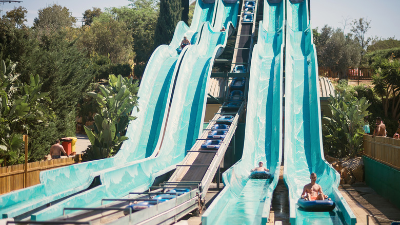 People going down a waterslide on tubes in Zoomarine in Portugal