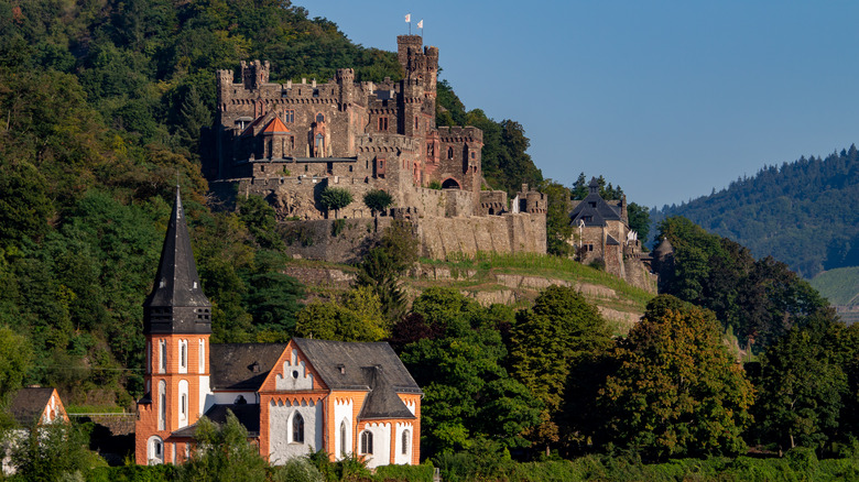 Castle and church against trees