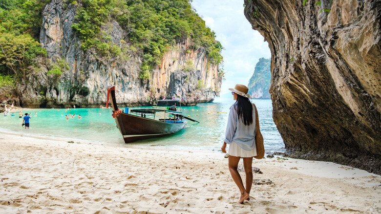 Woman walking on the beach in Thailand