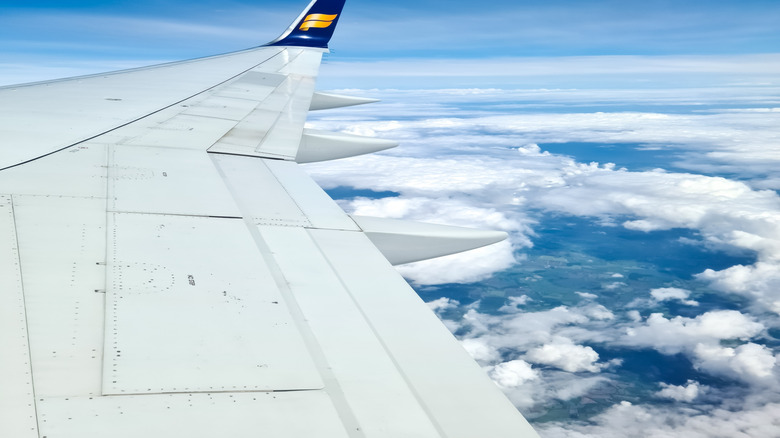 Icelandair plane in flight above a cloud