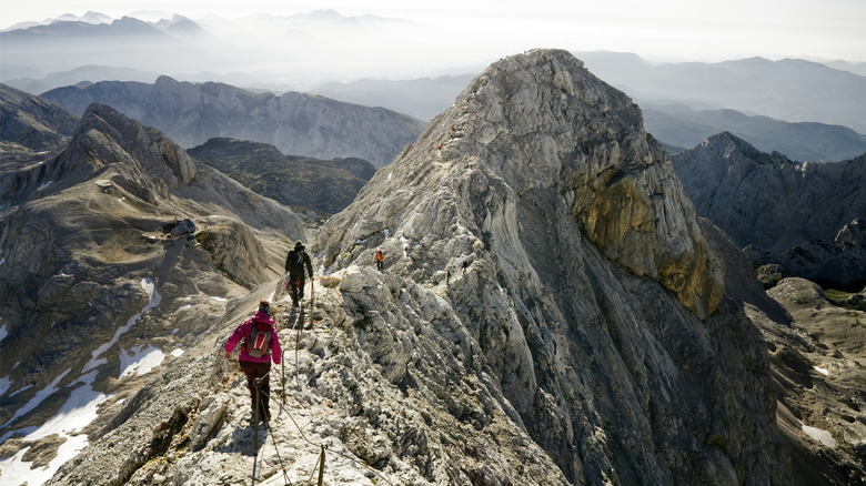 Mountaineers climbing ridge on Triglav mountain, Slovenia