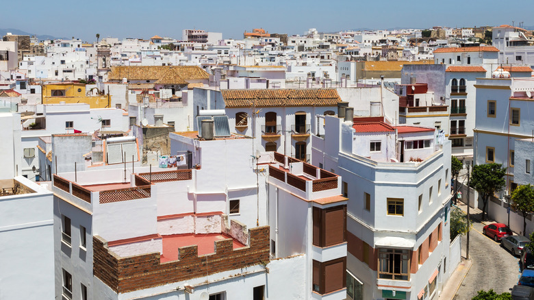 A view across white buildings in the town of Tarifa, Spain