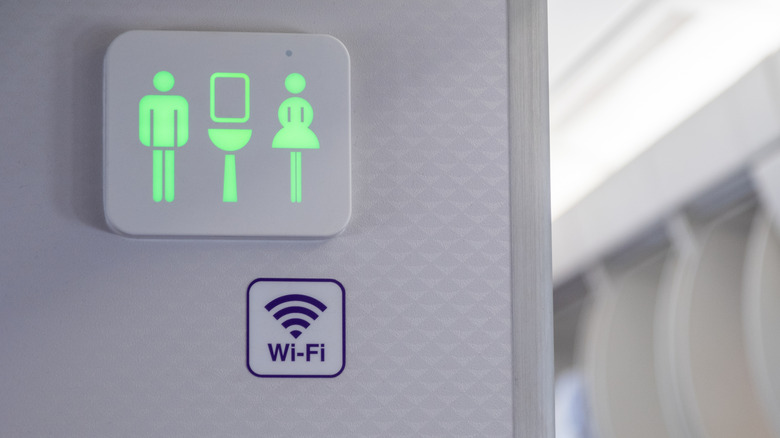 The sign to an airplane toilet