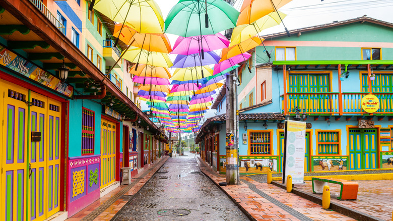 A colorful umbrella-covered street in Guatapé, Colombia