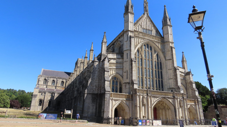 The towers, arches, and stained glass windows of Winchester Cathedral