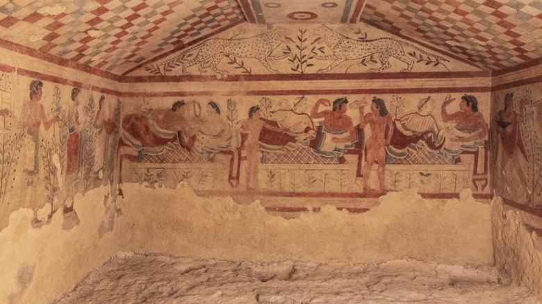 A fresco of a banquet and leopards inside a tomb in Tarquinia, Italy