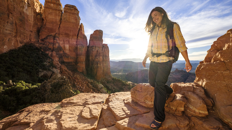 Woman hiking on a rocky cliffside