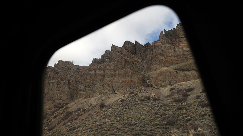 Jagged mountain view out the window of an Amtrak train