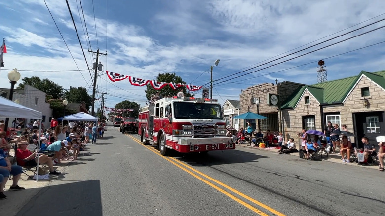 Fire truck driving by in the town's famous Fourth of July festival