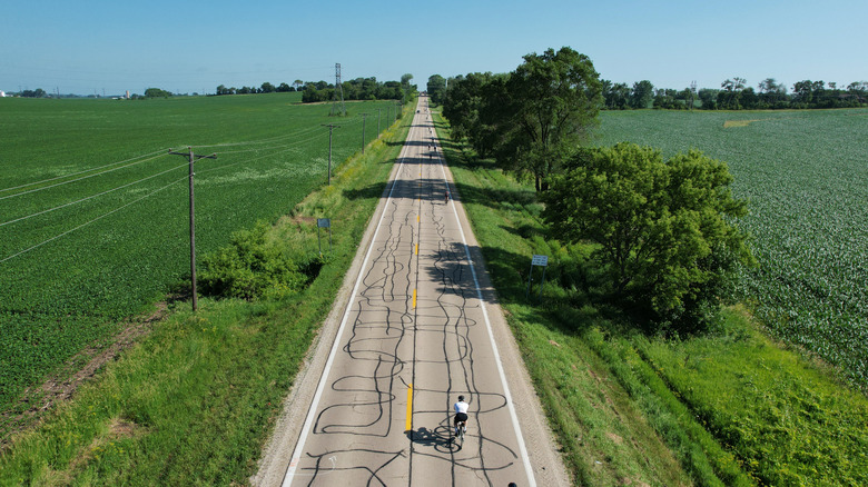 An overhead view of cyclists on a long straight country road in Rockford, Illinois