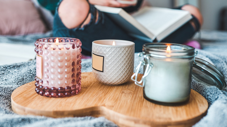 Three luxury candles in glass and ceramic moulds