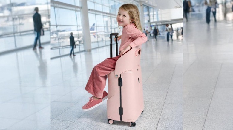 Little girl sitting on a MiaMily Carry-On