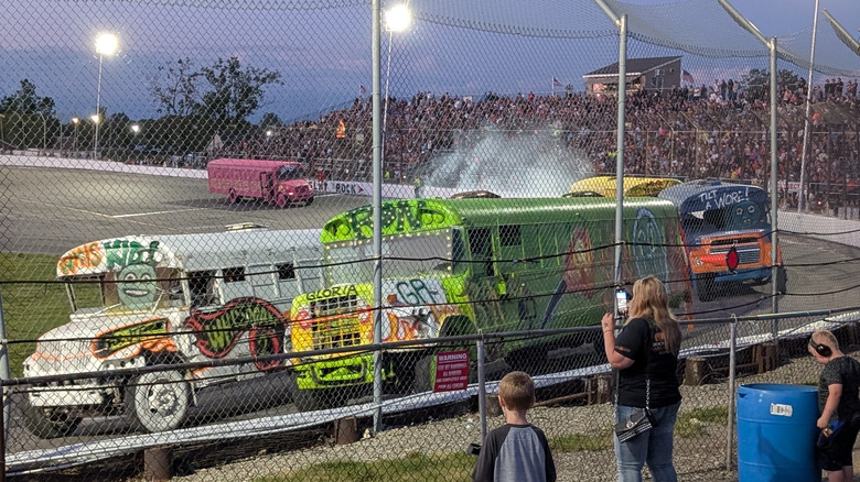Colorful buses race at the Flat Rock Speedway
