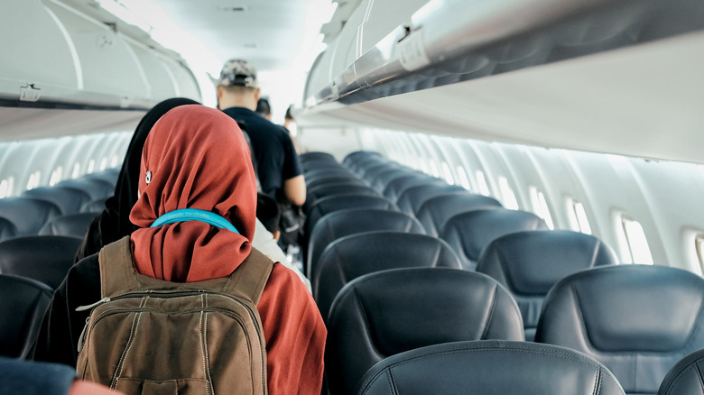 passengers waiting to disembark plane