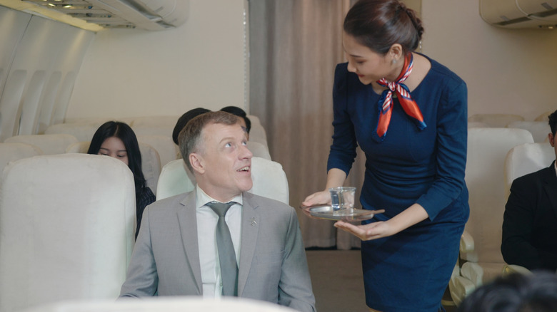 passenger tralking to flight attendant