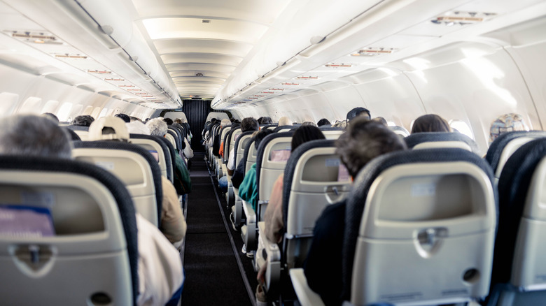 A plane fill of people waiting to take off