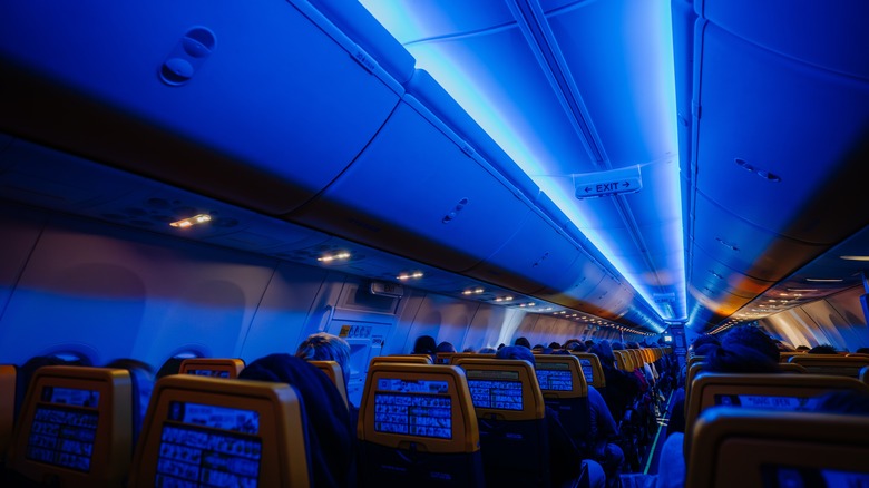 airplane cabin with dimmed lights