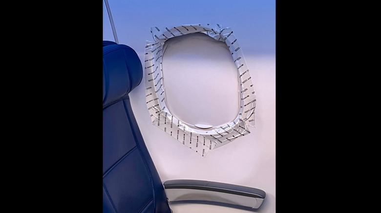 Broken plane window taped up
