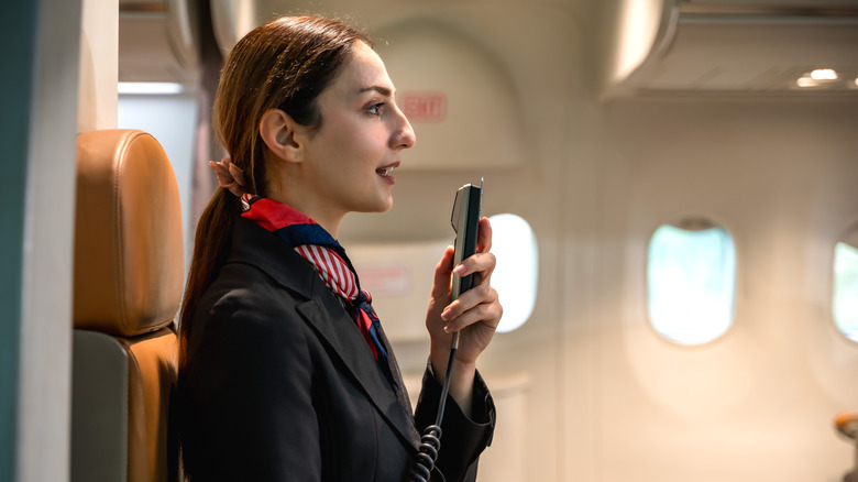 Flight attendant making an announcement