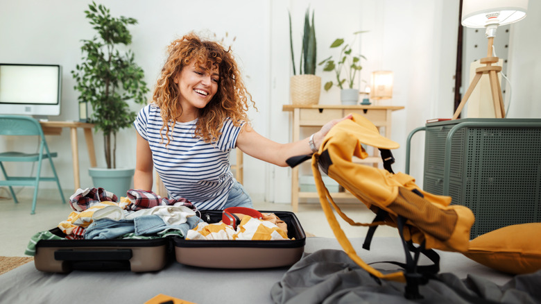 A woman packing her suitcase