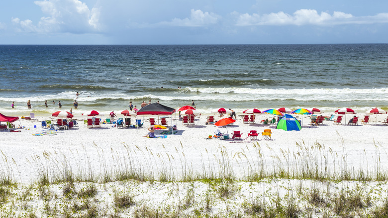 A white sand beach in Niceville, Florida with parasol umbrellas