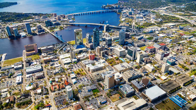 Aerial view of buildings, bridges, and water in downtown Jacksonville, Florida