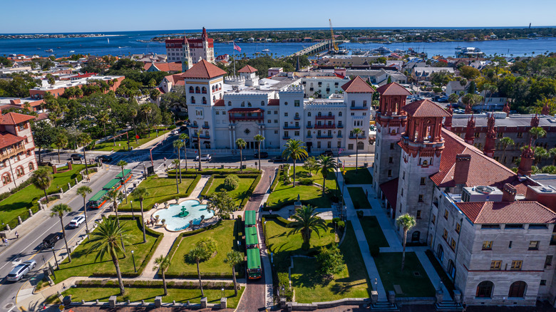 Water in the background of buildings surrounding a courtyard in St. Augustine, Florida