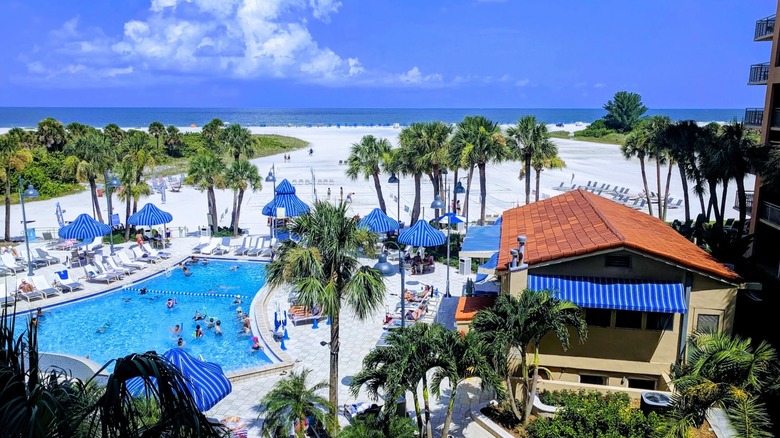 Elevated view looking out over the pool toward the private beach on the Gulf at the Clearwater Beach Sheraton Resort at Sand Key, Florida