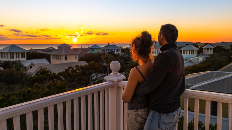 A couple watching the sunset in Seaside