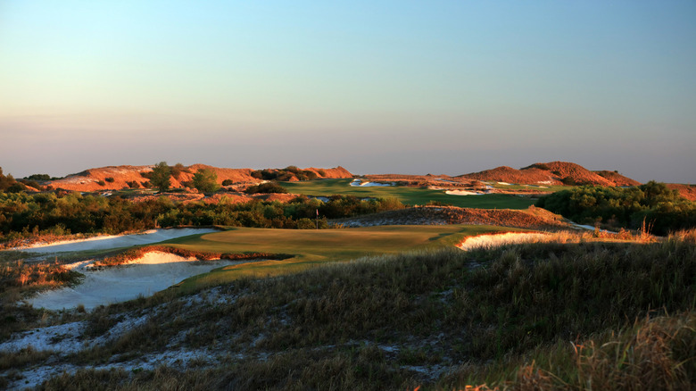 Streamsong Resort golf course with dunes backdrop