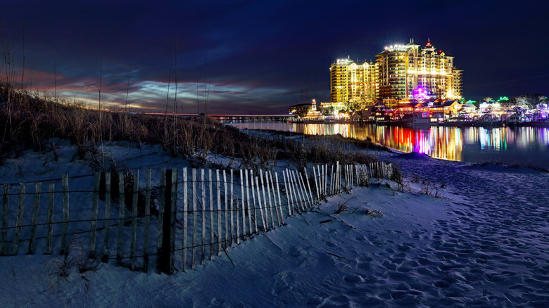 View of sunset and and hotels and bars from the beach in Destin, Florida