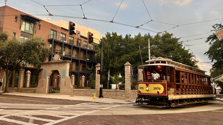 The Ybor City streetcar runs past Parque Amigos de José Martí