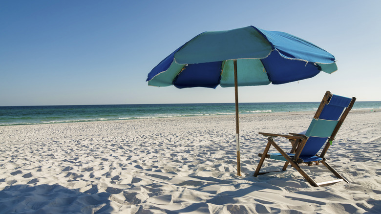 Umbrella and chair on empty Destin beach