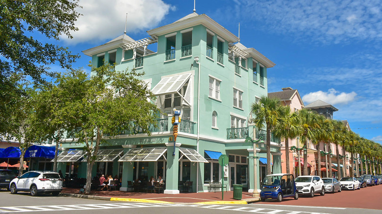 View of a bright green corner building in Celebration, Florida