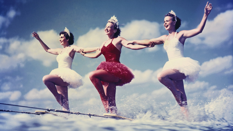 A trio of waterskiing ballerinas perform at Cypress Gardens, Winter Haven, Florida circa 1953
