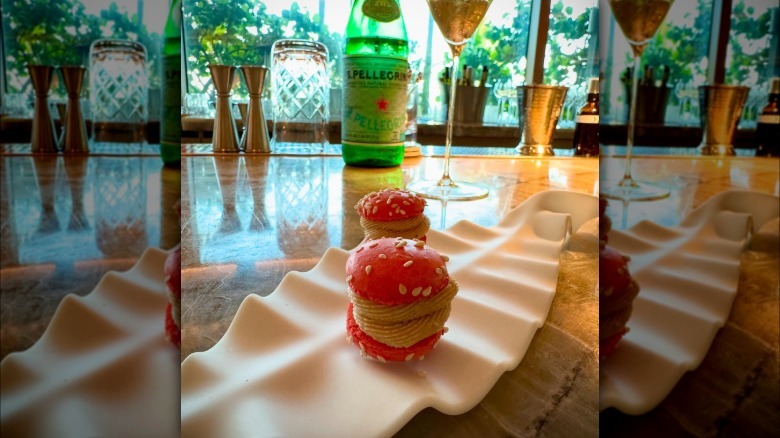 Pink macarons on a plate at Chef's Counter at Maass in Fort Lauderdale