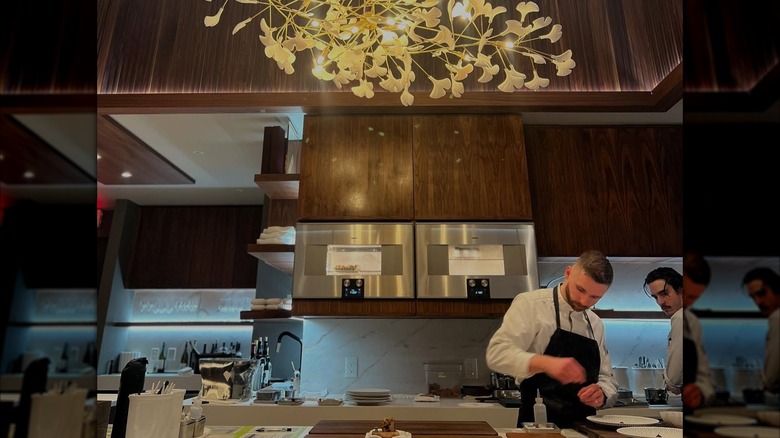 Chef preparing dishes at Ômo by Jônt in Orlando, Florida