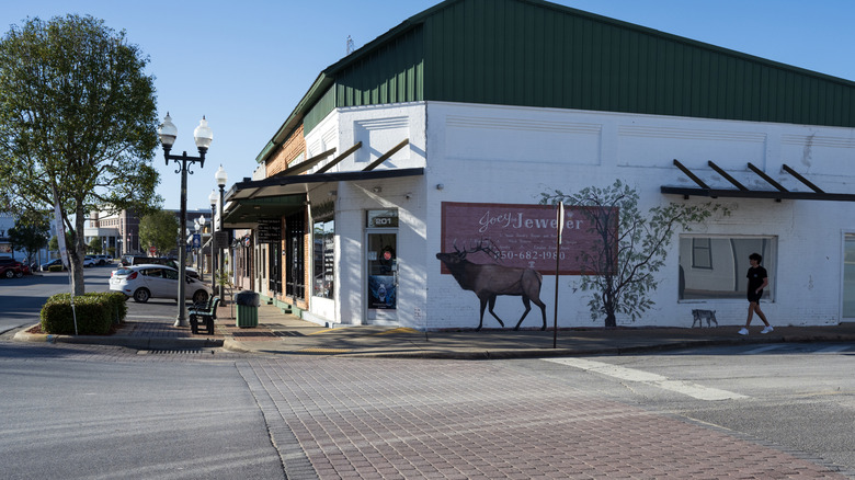 A young man walking at downtown street of Crestview, Florida