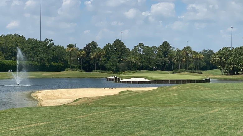 Greens, sand, water fountain at Hawk's Landing Golf Course